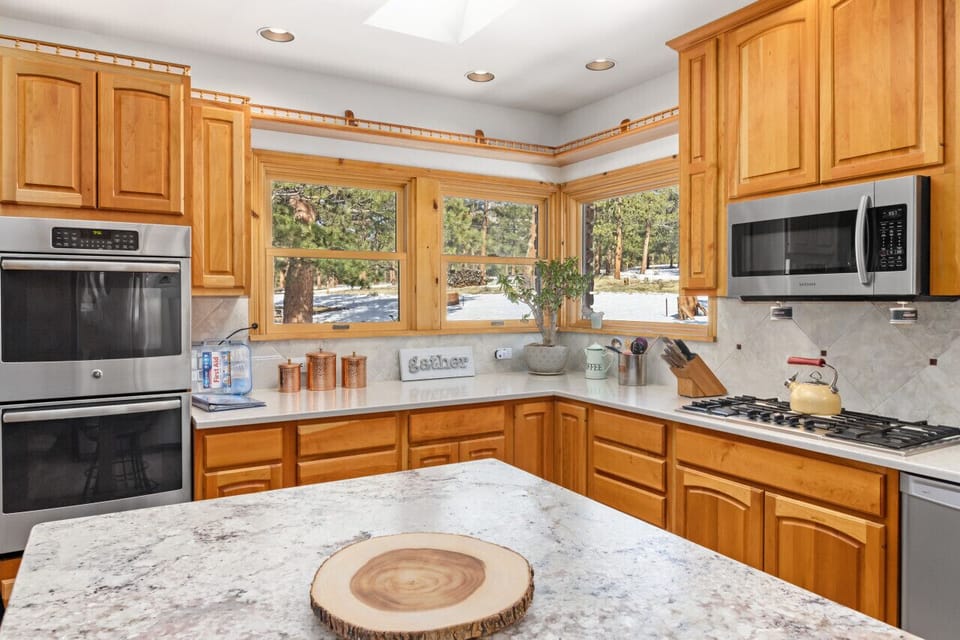 Double oven, gas range, dishwasher and large refrigerator