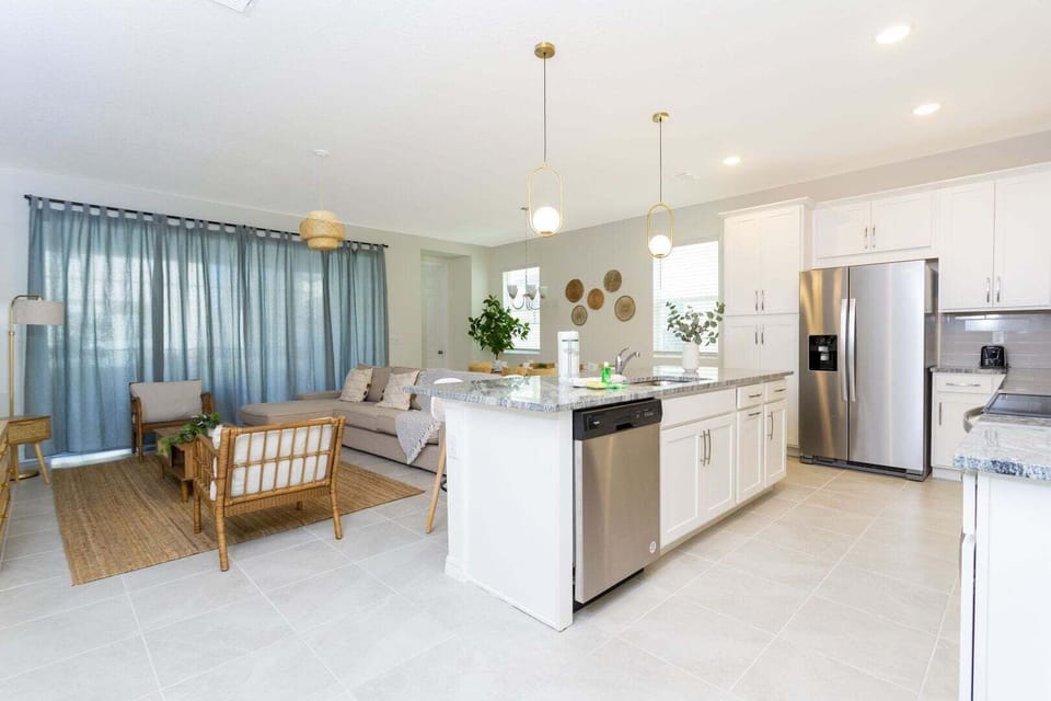 The living room, dining room and kitchen perfectly integrate into one ambience, ideal for socializing during the holidays.