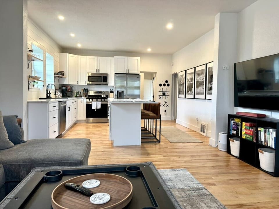 Open-concept living room with smart TV, board games, and chef`s kitchen -- ideal for group gatherings