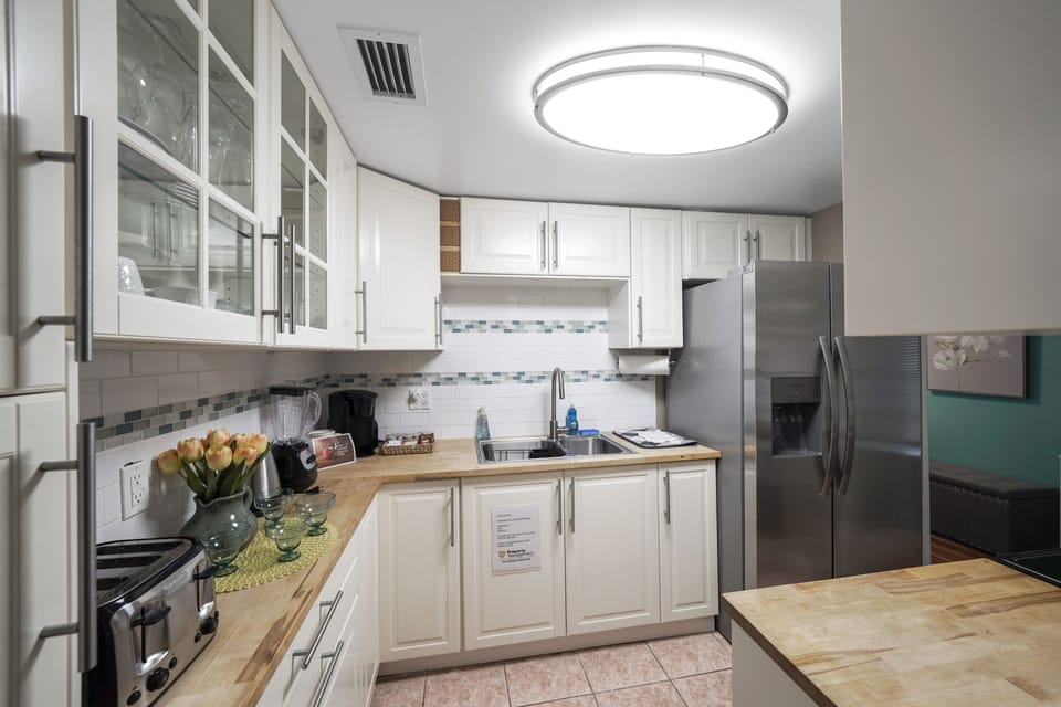 As you enter our kitchen, you'll immediately sense the fusion of functionality and style. This isn't just a place to cook; it's a stage for culinary creativity. 