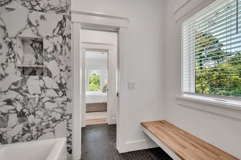 All three bedrooms share a marble bathroom, combining elegance with functionality.