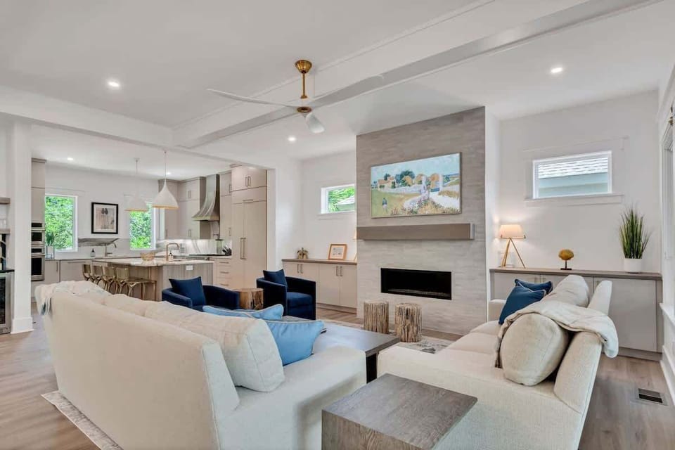 The living room offers plenty of seating, ideal for watching shows or connecting with friends and family in comfort.