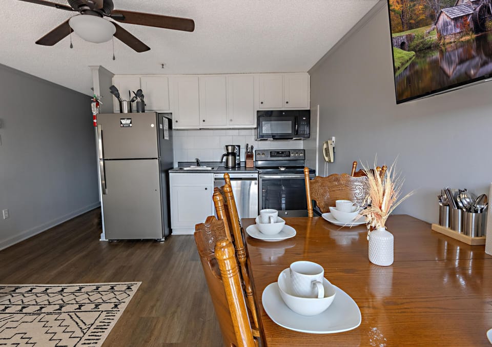 Gather around the table with your group in front of the 51" smart TV.