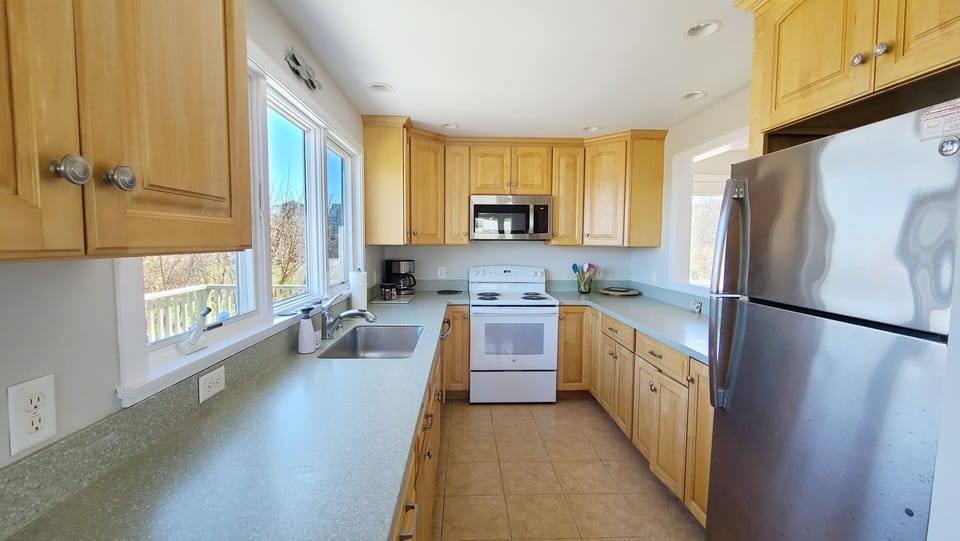 Nicely equipped kitchen off dining area