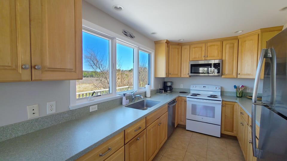 Nicely equipped kitchen off dining area