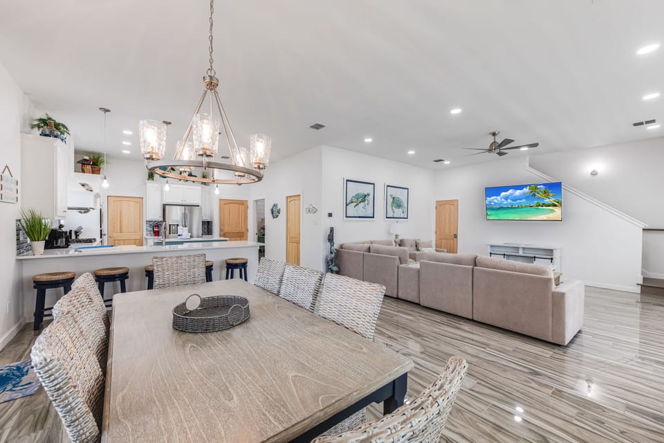 Interior - The kitchen, dining, and living areas blend seamlessly for a bright and airy feel