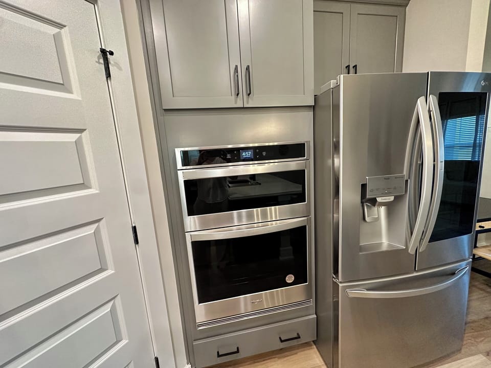 Built in oven, microwave. Large appliances and food pantry
