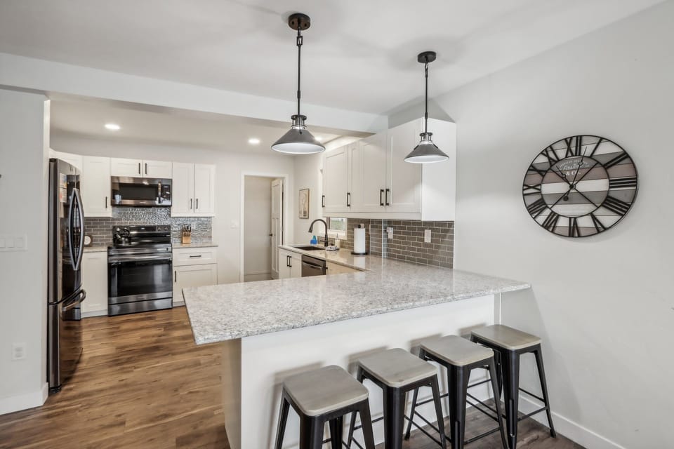 Brand new quartz countertops and stainless appliances.
