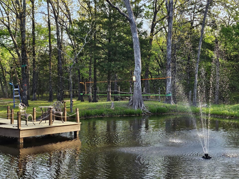 Private stocked pond with fishing deck