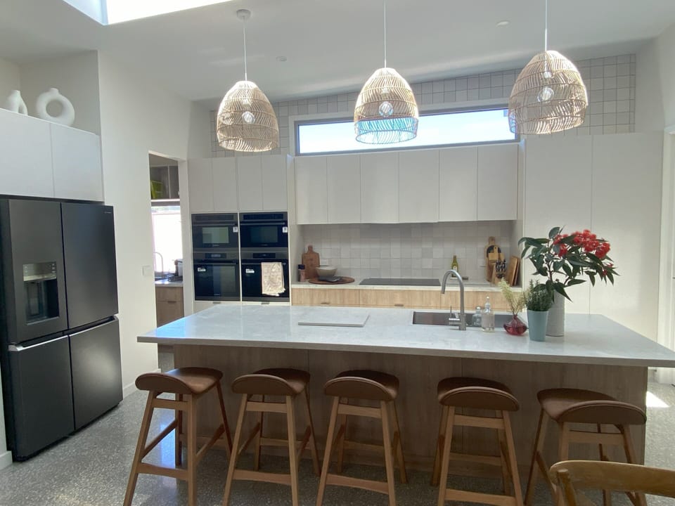 A gourmet kitchen with 4 ovens, induction cooktop