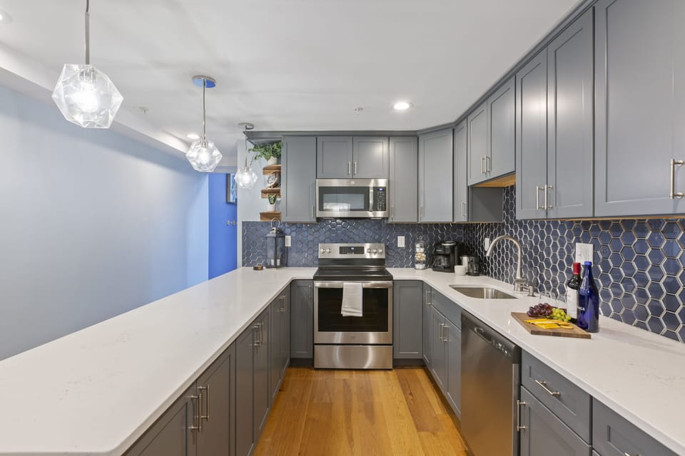 Style, comfort in kitchen with stainless steel appliances.