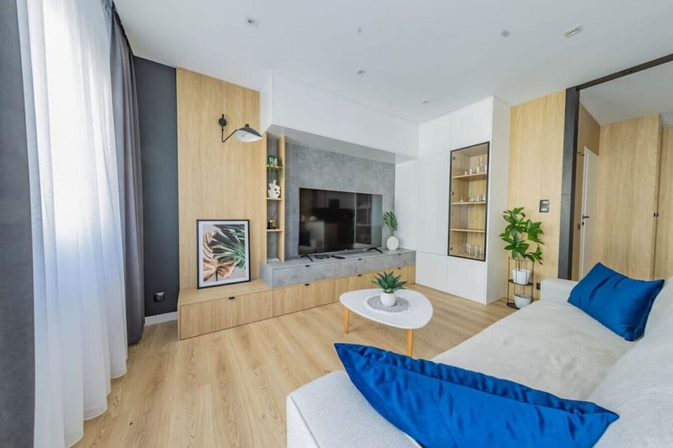 Comfortable Living Room with Sofa Bed and Smart TV | Book Now with RENTUJEMY