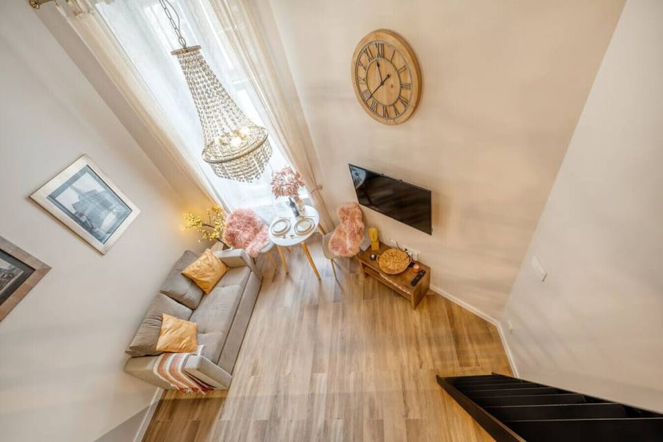Comfortable Living Room with Sofa Bed and Smart TV | Book Now with RENTUJEMY