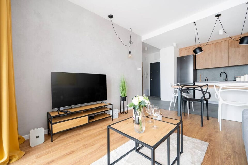Living Room with Sofa Bed, Smart TV and Balcony | Book Now with RENTUJEMY.COM