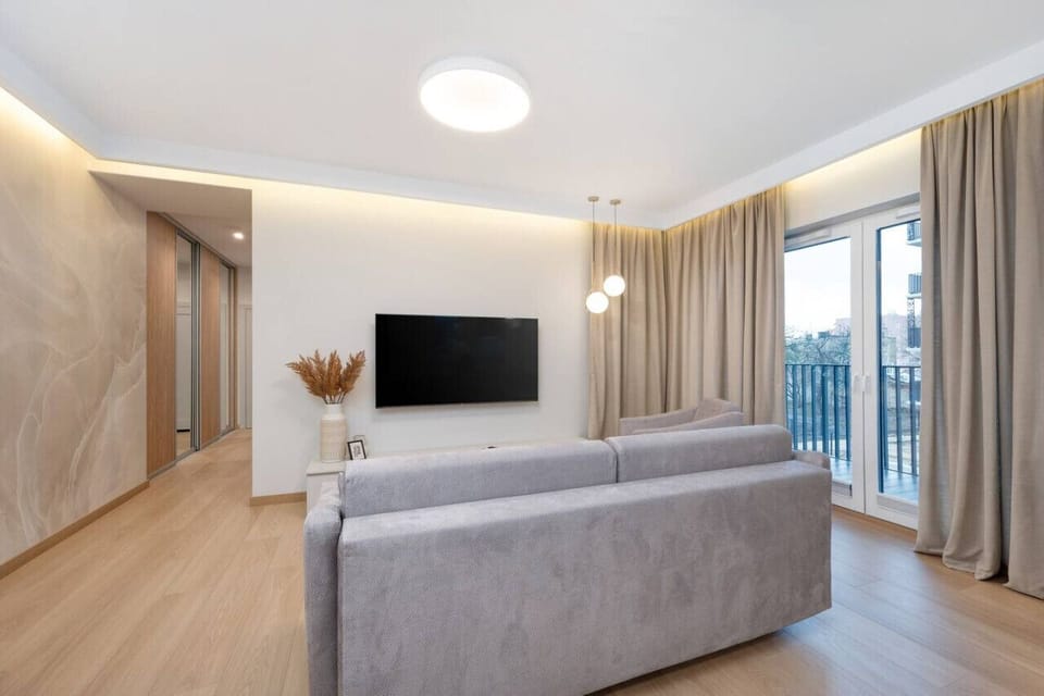 Comfortable Living Room with Sofa Bed and Smart TV | Book Now with RENTUJEMY