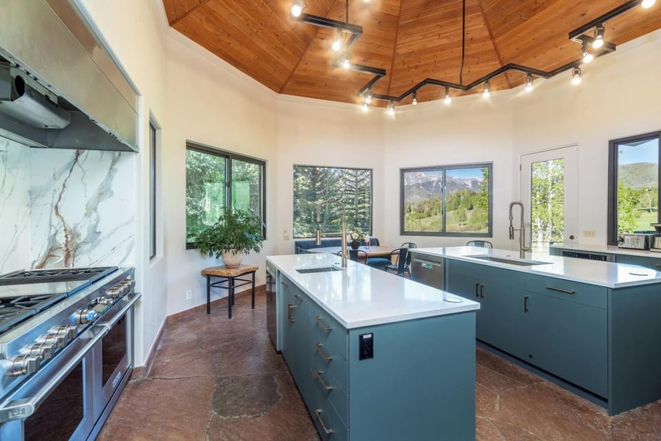 Kitchen - separate cooking and clean-up islands optimize the functionality of the expansive space