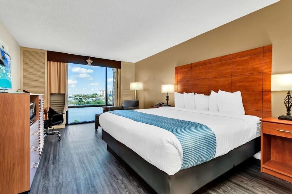 Sink into a cloud-soft king bed with skyline views.