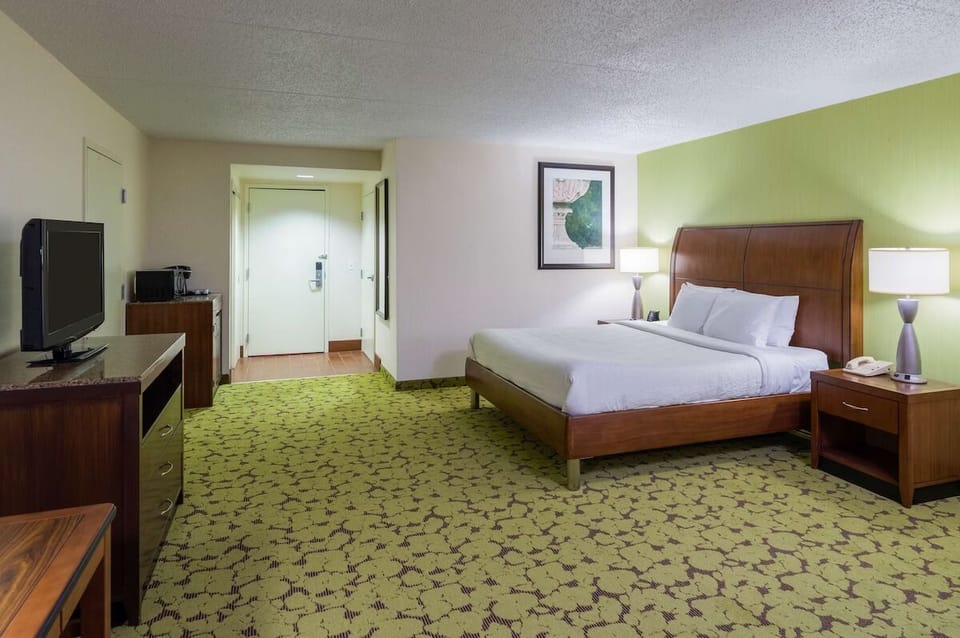 Settle into a serene king bed with warm bedside lighting.