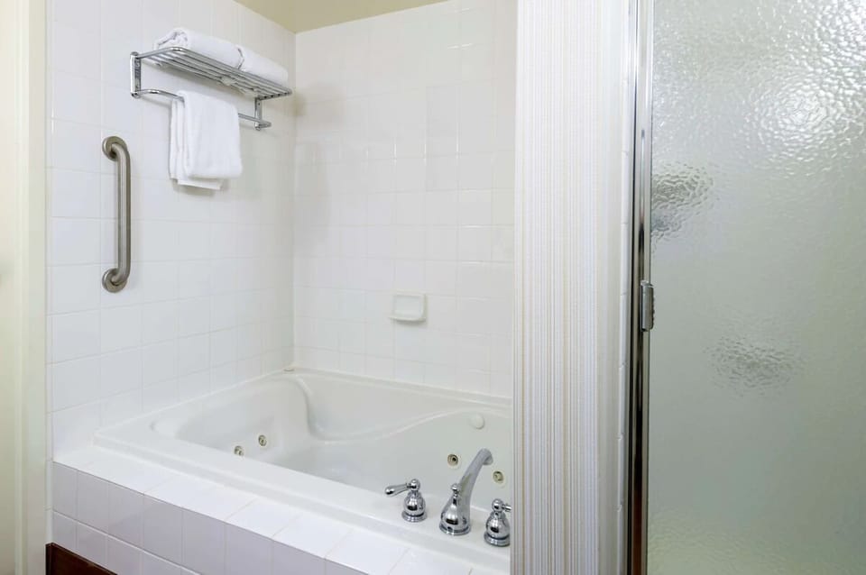 Recharge in a roomy king retreat with dedicated workspace.