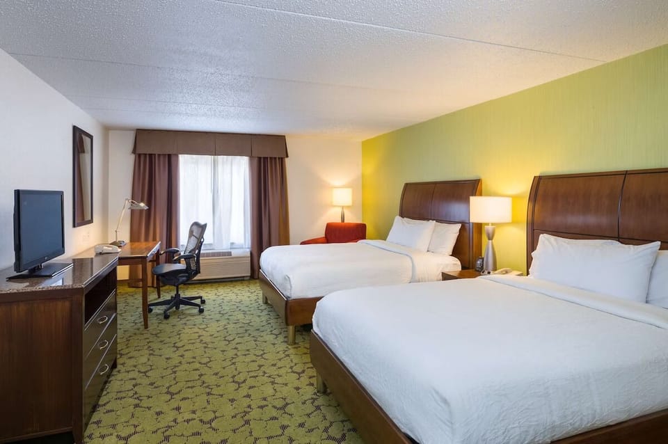 Stretch out with two crisp beds in a spacious room.