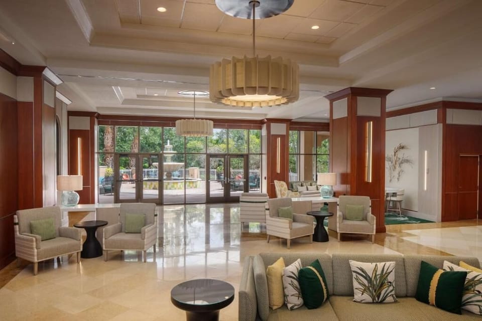 Unwind in the airy lobby with plush seating and sunshine.