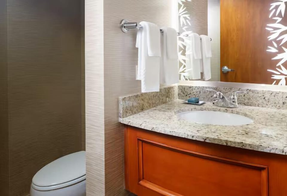 Start your day at a bright vanity with plush towels.