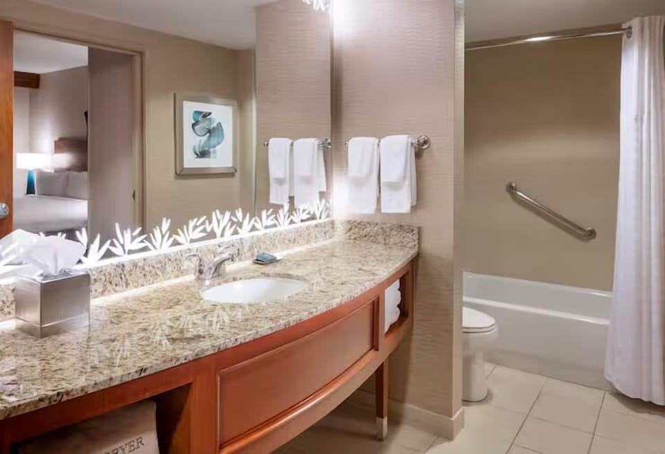Get ready with a bright vanity and plenty of counter space.