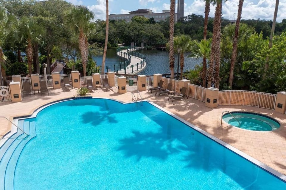 Dive into sparkling pool days with hot tub relaxation.
