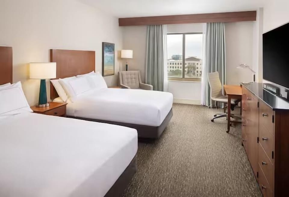 Wake up in airy comfort with two beds and daylight views.