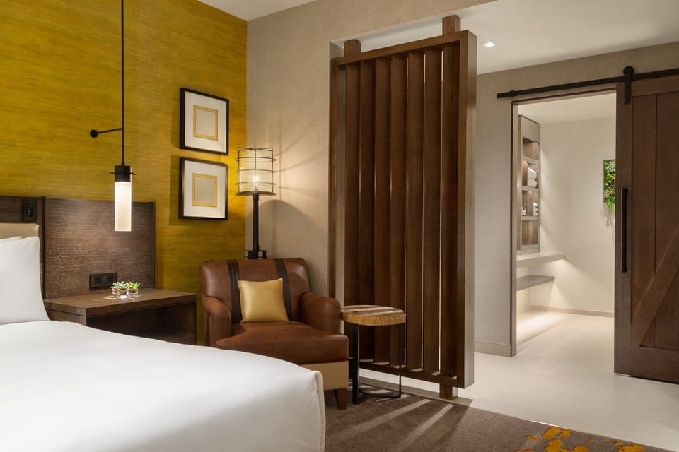 Unwind in a cozy corner with warm lighting and plush seating.
