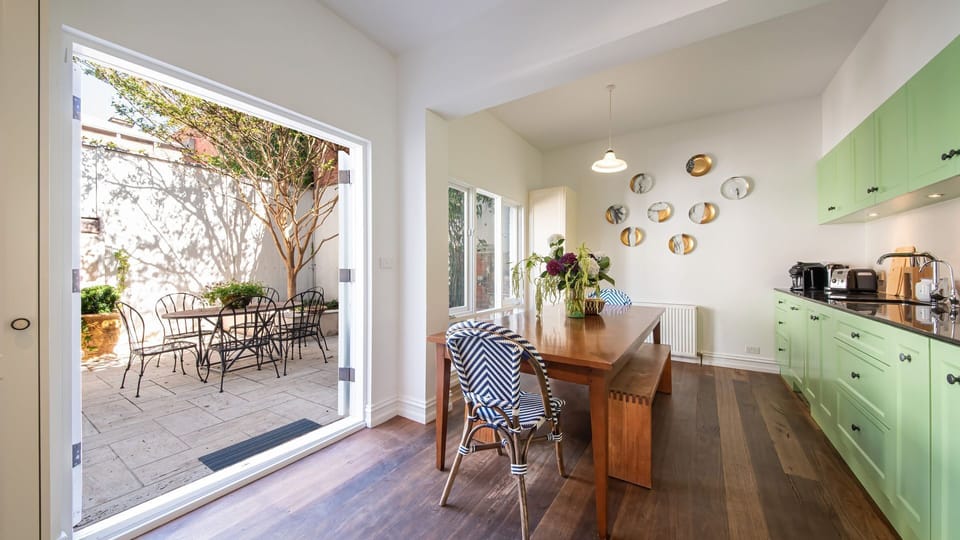 Kitchen/Dining flowing into private courtyard