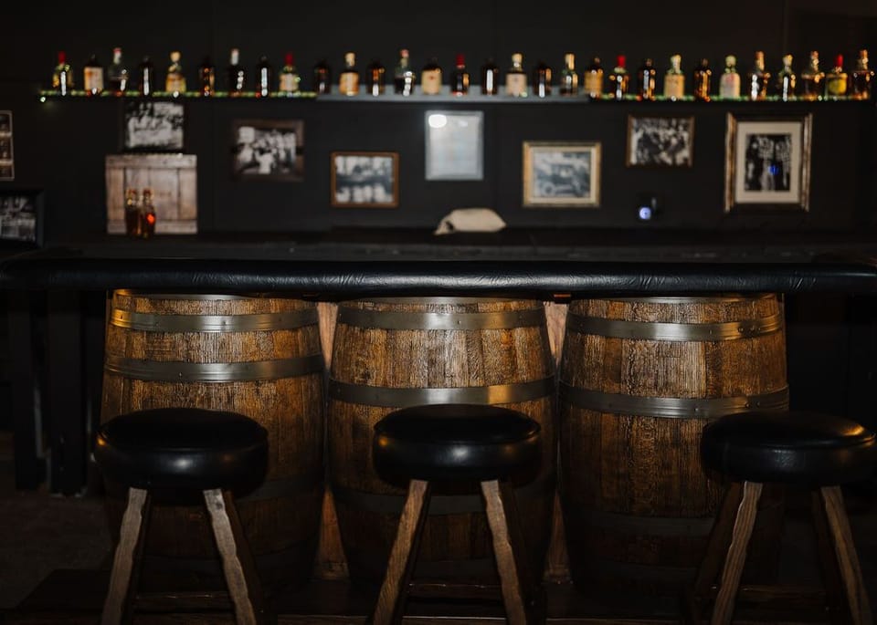 Prohibition-era-themed Speakeasy bar & lounge with vintage whiskey barrels