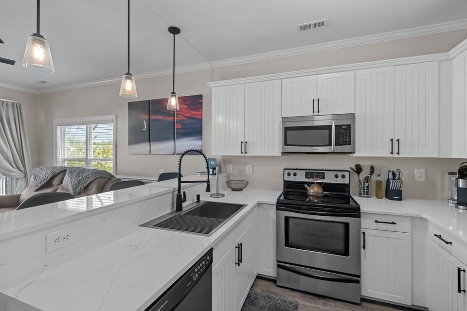 Our kitchen is a chef's paradise boasting sleek countertops 