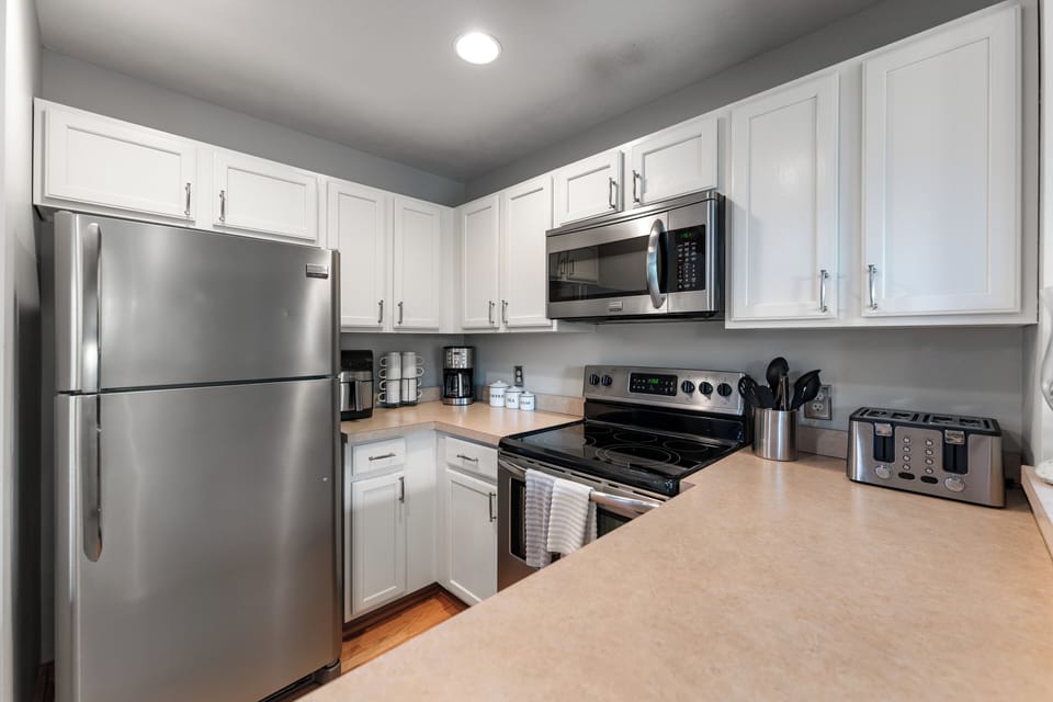 Kitchen Delight: Modern appliances and open counters invite culinary adventures in style!