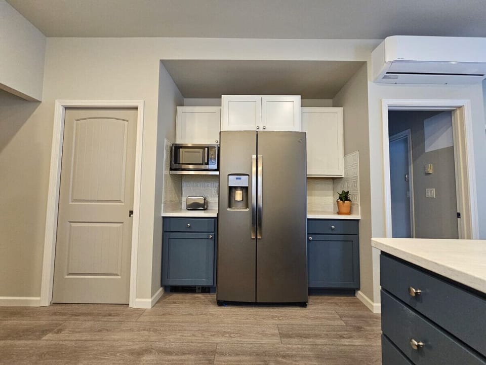 Fridge with Ice Maker, Door on Left to Washer and Dryer
