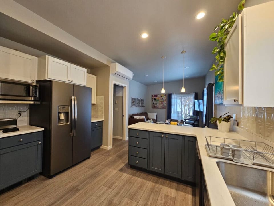 Ample Full Kitchen with 4 Burner Stove, Fridge, Microwave, Oven and D/W.