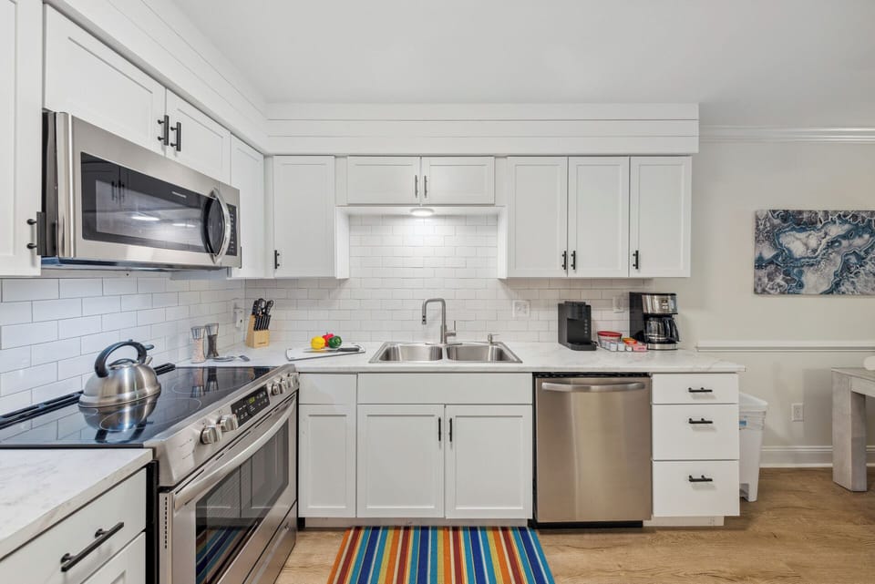 A fully-equipped kitchen has everything necessary to whip up a meal, while the combined living and dining area invites moments of laughter and connection with loved ones.