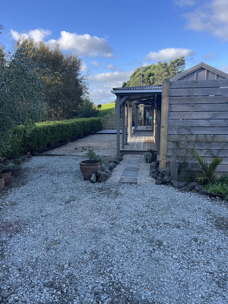 Patio: Evening view with lights on, from the car park.