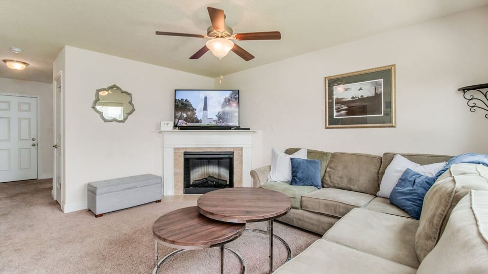 he cozy living room offers a comfortable seating area, perfect for relaxation and family gatherings