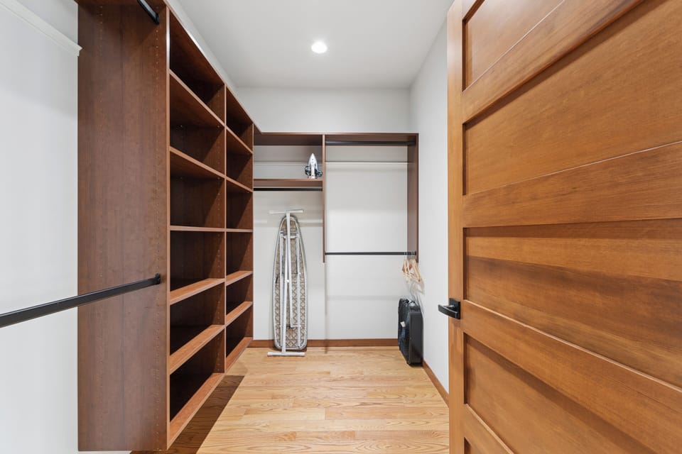Unpack with ease in your generous walk-in closet, with built-in shelving, hanging rods, and even space for an ironing board—everything you need to stay organized during your stay.