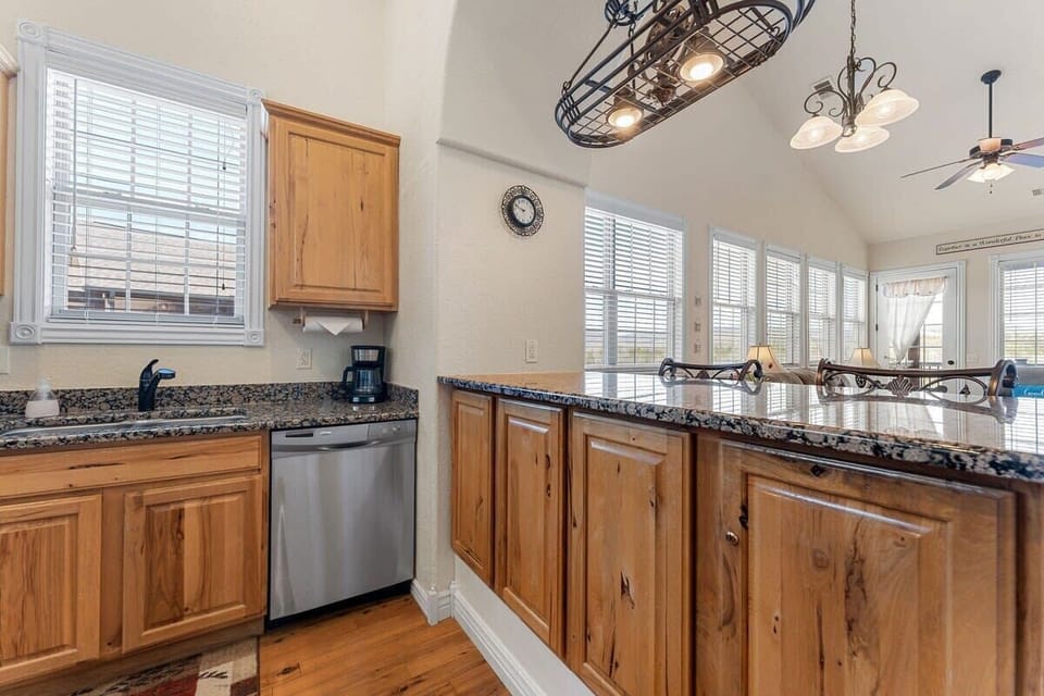 Lots of room on the bar area and stocked cabinets!