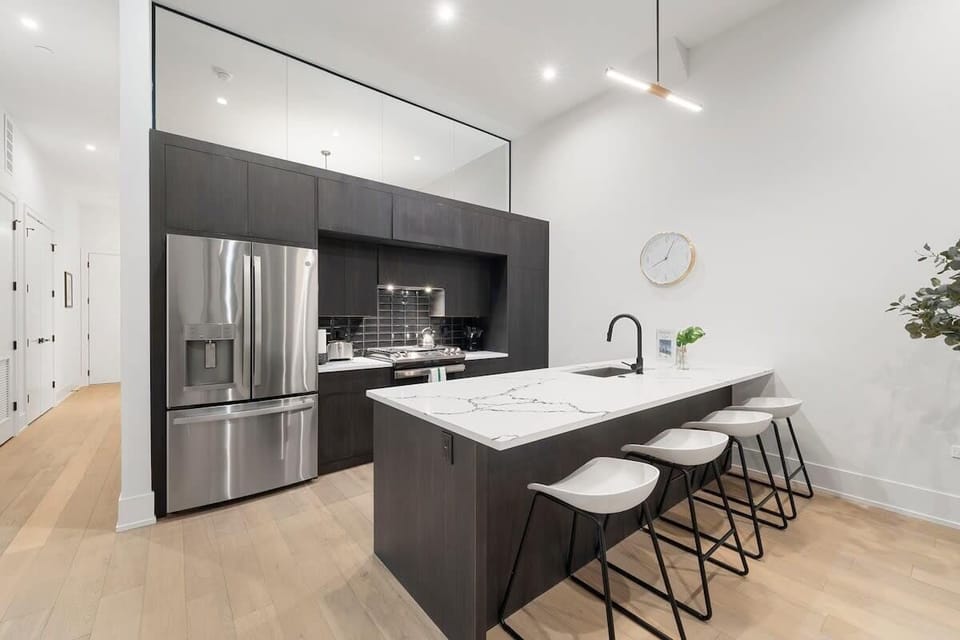 Sleek kitchen & dining area ready for shared meals.