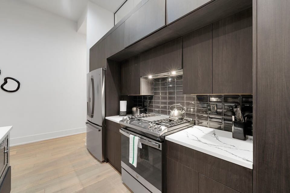 Modern kitchen setup w/ clean lines & warm wood tones