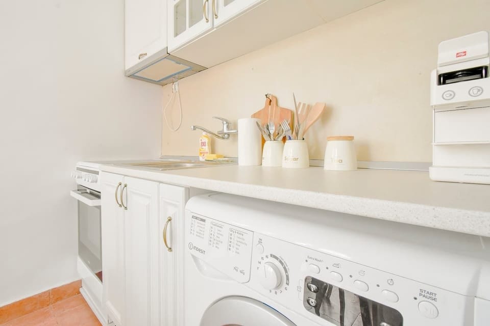 Whip up your favorite dishes in our compact, fully-equipped kitchen, complete with modern conveniences. Even laundry is a breeze with our in-unit washer. For any culinary queries or assistance, just send us a quick message!