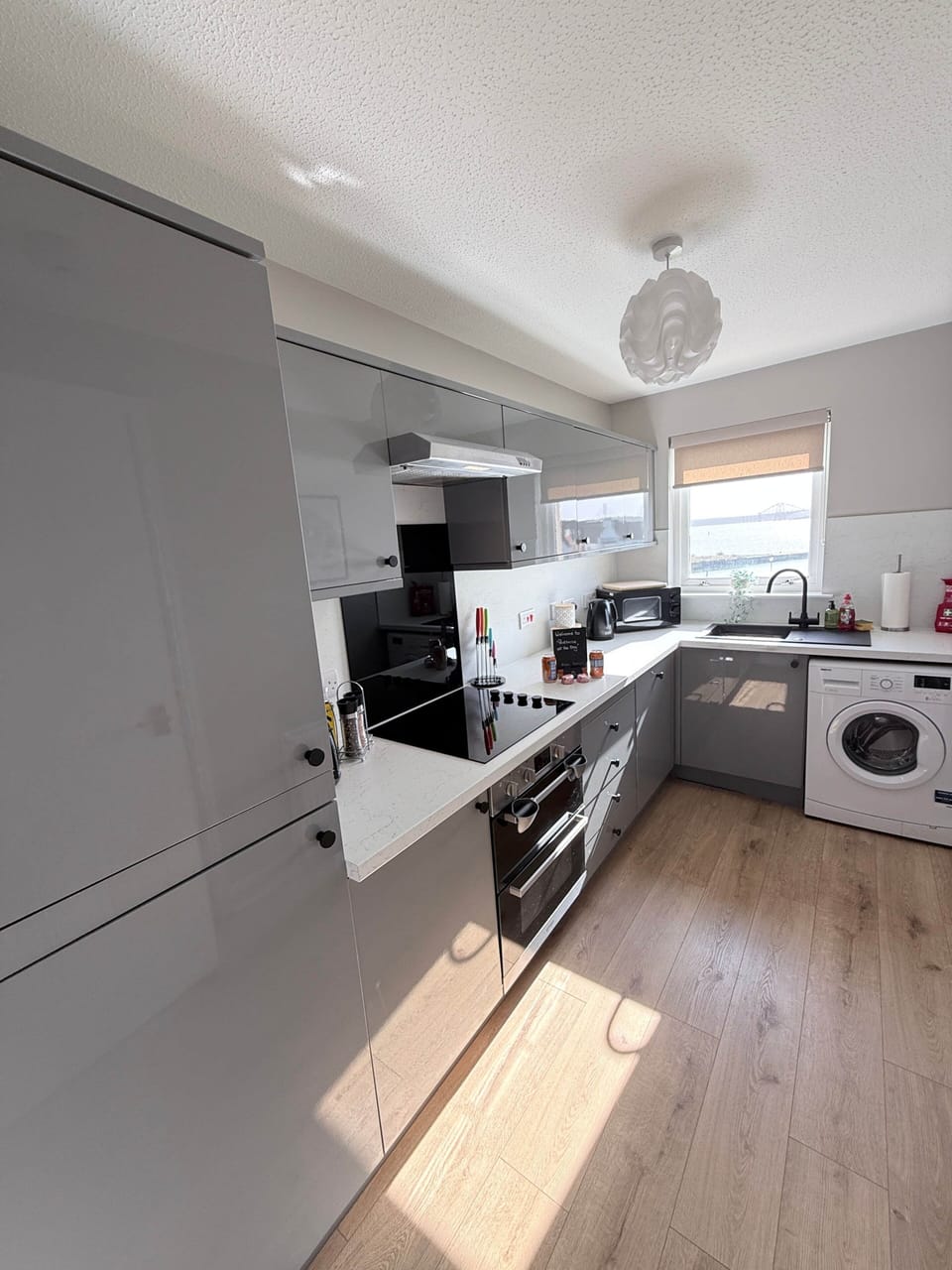 Bright and stylish kitchen space featuring modern appliances, ample workspace and all essentials provided