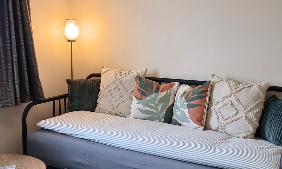 This cosy seating area is actually a comfy sofa-bed which sleeps two! Can be made up into a bed upon request.