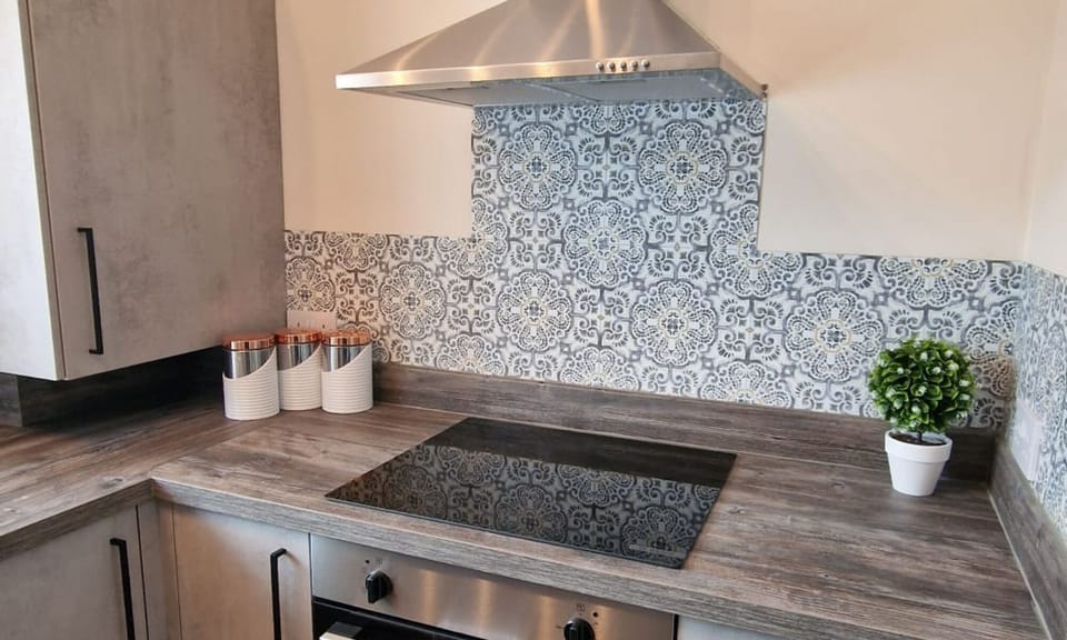 Branded appliances such as a Russell Hobbs Fridge Freezer, Bosch Electric Stove, and Zanussi Fan Oven. Ample storage and cooking utensils and crockery provided.