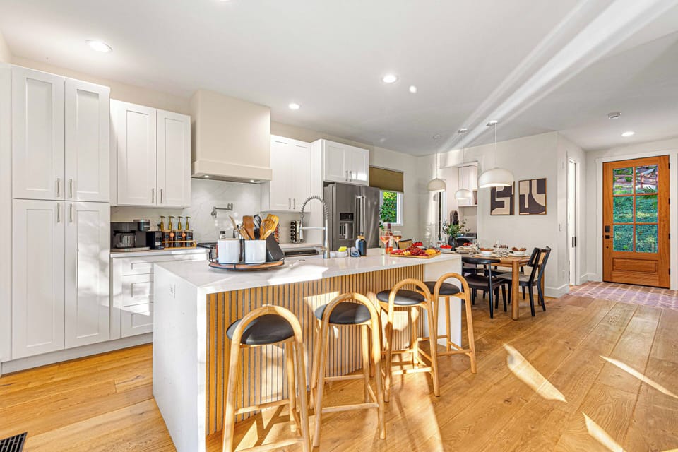 The open layout seamlessly connects the kitchen and dining area, making it easy for you to cook, dine, and enjoy each other's company.