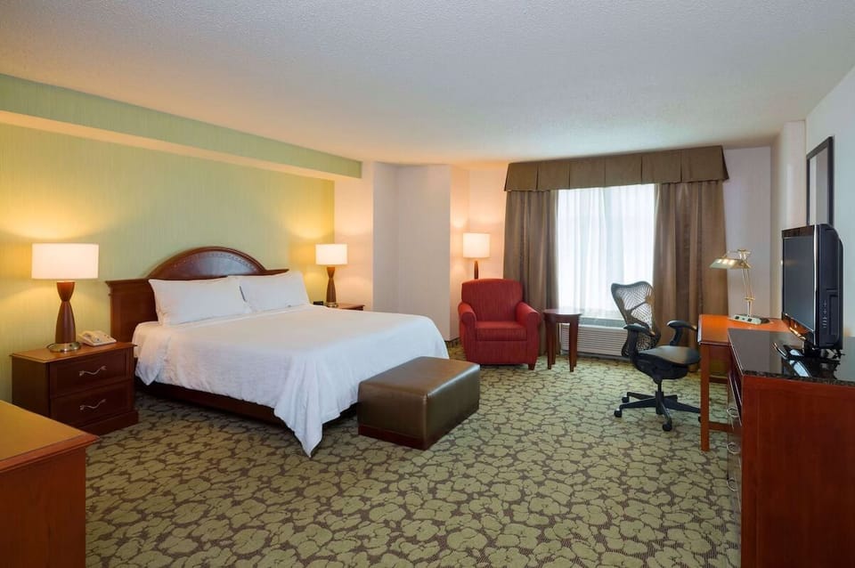 Sink into the spacious king bed and relax by the window.