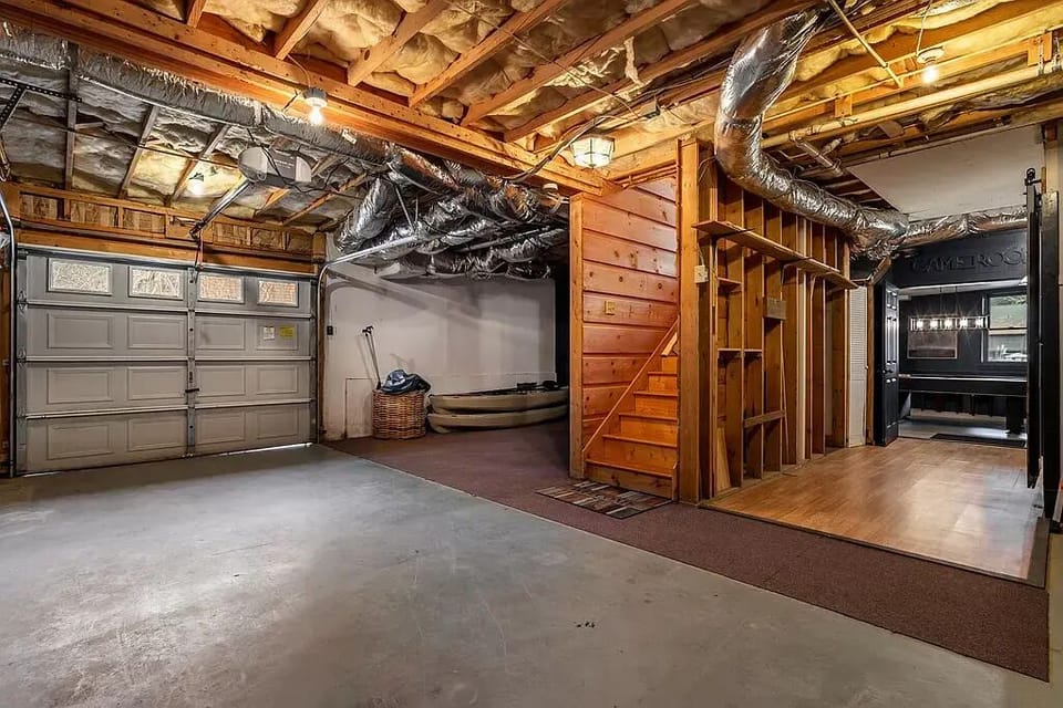 Garage and entrance to Game Room. There is now a ping pong table here!